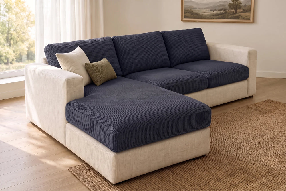 An L-shaped sofa with every seat and back cushion in Navy Blue fitted covers