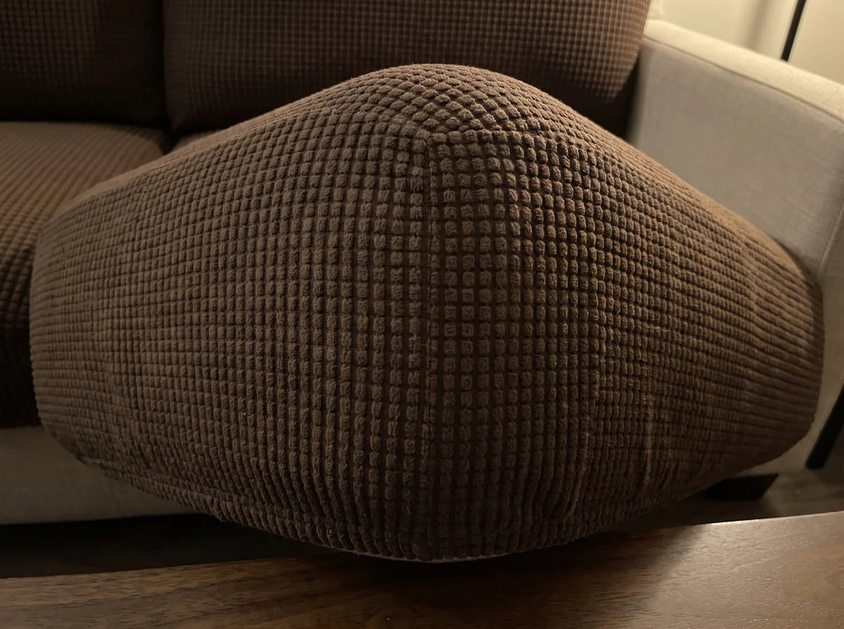 Close view of the corner of a seat cushion in a coffee Avelo Casa cover