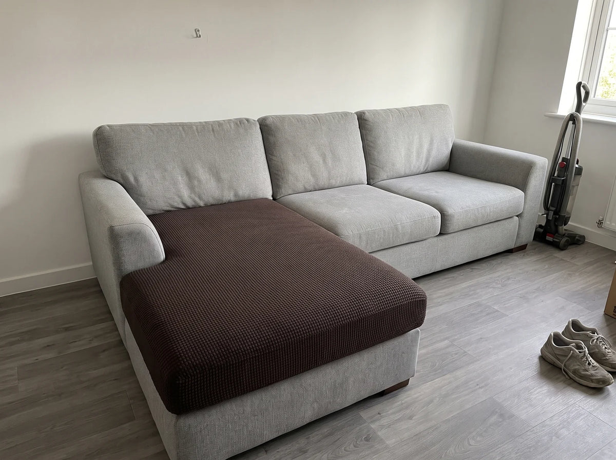 A coffee Avelo Casa cover fitted snug over a long chaise cushion in a living room